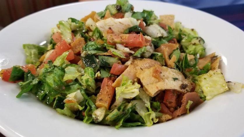 Fattoush Salad · Lettuce, tomatoes, parsley, onion, mint, cracked wheat, fresh lemon juice and the best of virgin olive oil.