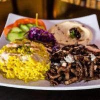 Beef Shawarma Platter (Family Size) · Marinated slices of Beef
- Choice of Hummus Or Rice 
- Choice Of Salad 
- Fresh Pita Bread