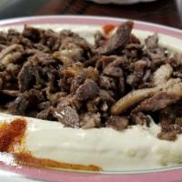 Lamb Shawarma Platter · Marinated slices of Lamb
- Choice of Hummus Or Rice 
- Choice Of Salad 
- Fresh Pita Bread