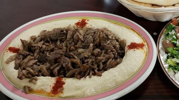 Beef Shawarma Platter · Marinated beef seasoned with special spice
- Choice of Hummus Or Rice 
- Choice Of Salad 
- Fresh Pita Bread