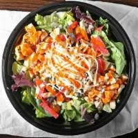 Buffalo Chicken Salad · House salad blend, grilled chicken breast, Buffalo sauce, shredded white cheddar, and tortil...