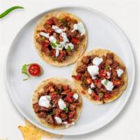 Beef Talks Taco · Beef tongue topped with cilantro, onions, and your choice of salsa.
