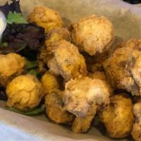 Fried Mushrooms · Fresh mushrooms tossed in our homemade batter and fried to a golden brown. Served with our h...