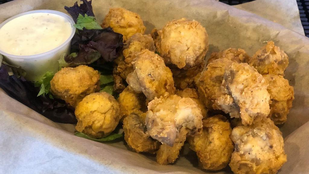 Fried Mushrooms · Fresh mushrooms tossed in our homemade batter and fried to a golden brown. Served with our house-made ranch.