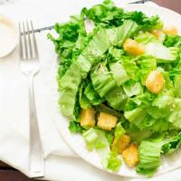 Caesar Salad · Classic Caesar salad with romaine lettuce, parmesan cheese, tomato wedges, croutons and Caes...