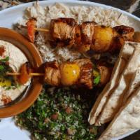 Med Platter · Hummus, tabbouleh, rice, pickles, pita, and protein of choice