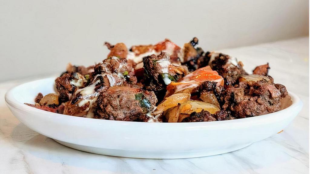 Kafta Side · Kafta beef cooked with onion and tomatoes.