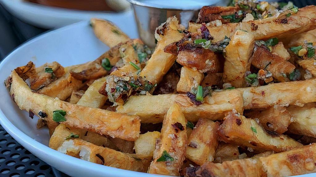 Zaatar Fries · Hand cut Zaatar Dusted Fries. Specify Pepper/Salt if you dont want Zaatar. 

Cilantro + Garlic pesto option available (pictured).
Comes with Toum garlic sauce - specify ketchup if you would like.