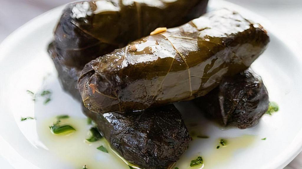 Grape Leaves · Stuffed with rice, parsley, tomatoes, and walnuts. 
4 pieces per order.