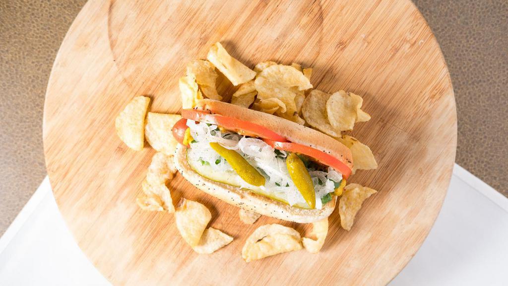 Classic Chicago · Poppy seed bun, all beef dog, yellow mustard, neon green relish, onion, sliced tomato, dill pickle spear, sport peppers, celery salt