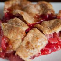 Strawberry Rhubarb Pie · Fresh cut rhubarb, plump strawberries, with a hint of lemon in a lattice crust. Serves 8.