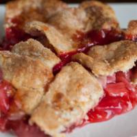 Strawberry Rhubarb Petite · Fresh cut rhubarb, plump strawberries, with a hint of lemon in a lattice crust.