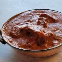 Chicken Makhani (Butter Chicken) · Flakes of Tandoor meat cooked with butter creamy sauce.