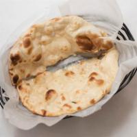 Naan · Regular Dough made with fine flour, milk, and spices.