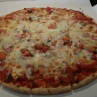 Margherita Thin Crust Pizza · Marinated fresh tomatoes, fresh garlic, and fresh basil.