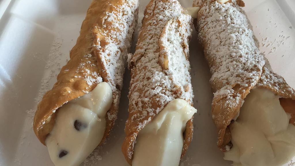 Cannoli · Tubular pastry shells stuffed with a sweetened filling of whipped ricotta cheese and chocolate chips.