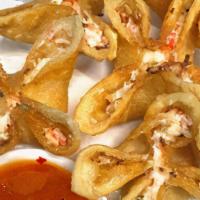 Crab Cheese Wontons · 6 Crab, cream cheese, scallion filled fried wontons.  Served with sweet chili sauce