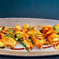 Jalapeño Bomb · Crab meat, cream cheese stuffed deep fried topped with spicy mayo and eel sauce, tobiko & sc...