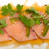 Yellowtail With Jalapeño · Thinly sliced yellowtail sashimi and jalapeño in ponzu sauce, topped with cilantro leaves. T...