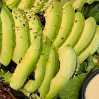 Avocado Salad · Mixed greens topped with thinly sliced avocado and sesame seed.  Served with house dressing ...