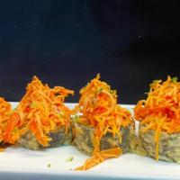 Volcano · Spicy tuna, avocado, and cream cheese in a deep fried roll, topped with spicy crab meat and ...