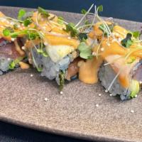 Out Of Control · Tuna, salmon, yellowtail, and avocado, topped with seared tuna, salmon and yellowtail, serve...
