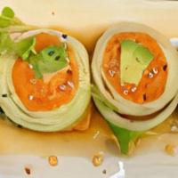 Spicy Salmon Naruto Style · Spicy Salmon and Avocado wrapped in English cucumber with ponzu based sauce.These items may ...