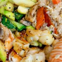 Hibachi Seafood Combination · Hibachi Style Lobster Tail, Shrimp and Scallop with wok sauteed vegetables and fried rice.  ...