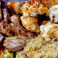 Hibachi Filet Mignon And Lobster Tail · Hibachi Style Filet Mignon and Lobster Tail with wok sauteed vegetables and fried rice.  Ser...