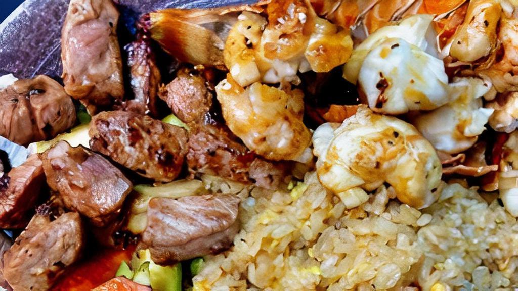 Hibachi Filet Mignon And Lobster Tail · Hibachi Style Filet Mignon and Lobster Tail with wok sauteed vegetables and fried rice.  Served with mushroom soup and house salad.  Yum Yum sauce and Ginger Sauce on the side.