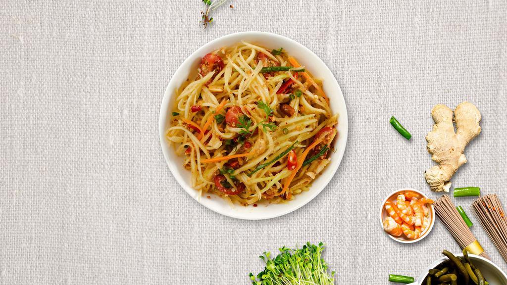 Green Alpha Papaya · Shredded green papaya with green beans, tomatoes, carrots, and roasted peanuts in spicy lime dressing.