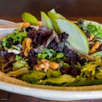 Apple Walnut Salad · Fresh spring mixed greens, Feta cheese, crisp apples, candied walnuts, dried cranberries and...