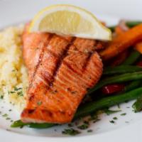 Grilled Wild Salmon · Gluten-free. Raw or undercooked. Roasted garlic–basil butter, rice, fresh vegetables.