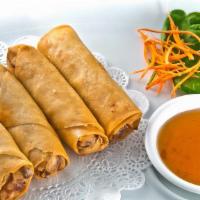 Spring Rolls · Deep-fried chopped vegetables rolled in a wheat wrapper and served with plum sauce.