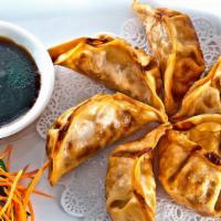 Pot Stickers · Pan fried dumpling filled with pork and vegetable served with our house's special soy sauce.