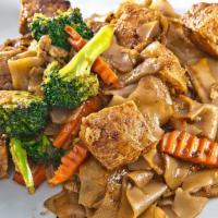 Phad See Ew · Wide rice noodles stir-fried with sweet soy sauce, broccoli, carrots and egg.