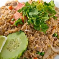Thai Fried Rice · Stir-fried steamed rice with onions, tomato, snow peas, carrots, egg and cilantro.