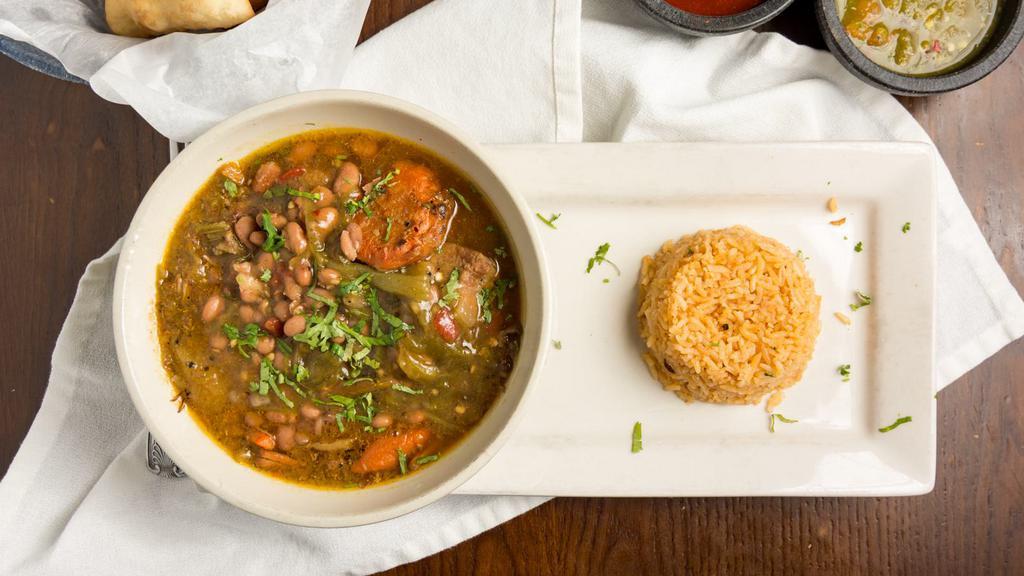 Green Chile Pork Stew · hatch green chile | shredded pork | potatoes | beans | celery | carrots | served with spanish rice and a sopapilla