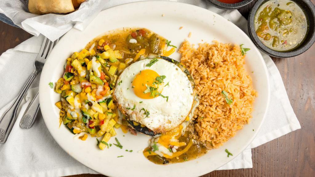 Blue Corn Stacked Enchiladas · new mexican blue corn stacked enchiladas | fried egg | choice of cheese or meat | sopapilla | enchilada sauce | two sides