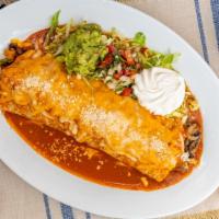 Fajita Burrito · Flour tortilla filled with your choice of chicken or steak, covered with enchilada sauce and...