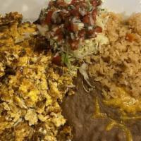 Machaca · Three eggs scrambled with shredded beef, onions, and bell peppers, garnished with lettuce an...