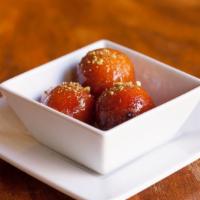 Gulab Jamun · Traditional warm dessert. Milk doughnuts made with “Khoya”, simmered in a sugar syrup flavor...