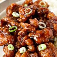 Firecracker Chicken · Starts sweet, finishes with a spicy kick, garnished with green onions. Spicy.