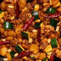 Kung Pao Chicken · A blazing sauce with seared chilies, peanuts, water chestnuts, zucchini and dry chili pepper...