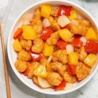 Sweet & Sour Chicken · Crispy white chicken with pineapple, red bell peppers, and onions in a sweet & sour sauce.