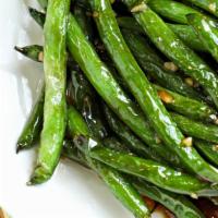 Green Beans · Freshly picked green beans pan seared in our delicious sauce.