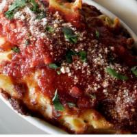 Baked Mostaccioli · Layered with ricotta, mozzarella, ground beef, & baked in our red sauce.