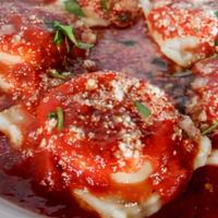 Ravioli · Cheese or meat (5 pc). In our red sauce.