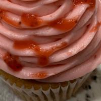 Strawberry Jumbo Filled Cupcake · Strawberry cake filled with fresh strawberry filling topped with a delicious strawberry crea...