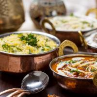 Mother India Tandoori Platter · An assortment of lamb boti kebab, chicken tikka, tandoori chicken, tandoori prawn, and lamb ...